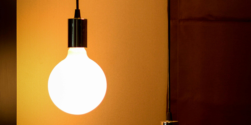 Modern LED bulb emits warm light, creating a cozy atmosphere.