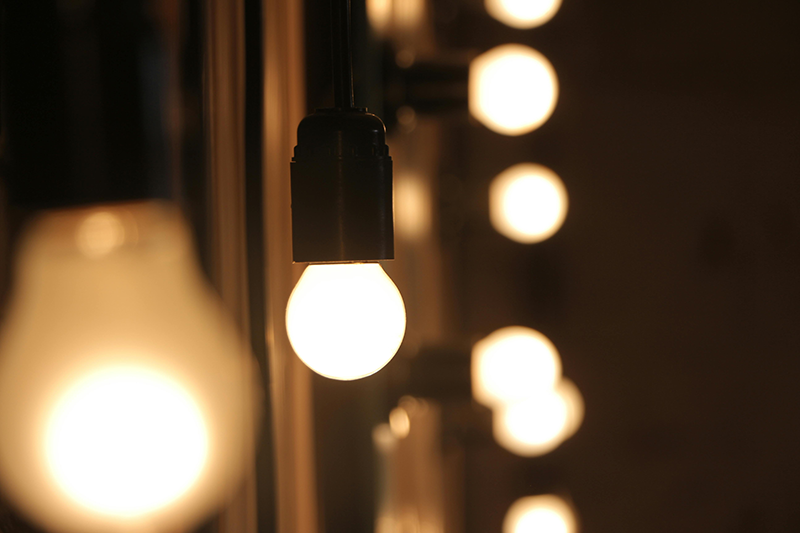 row of glowing light bulbs, soft warm illumination for ambient lighting