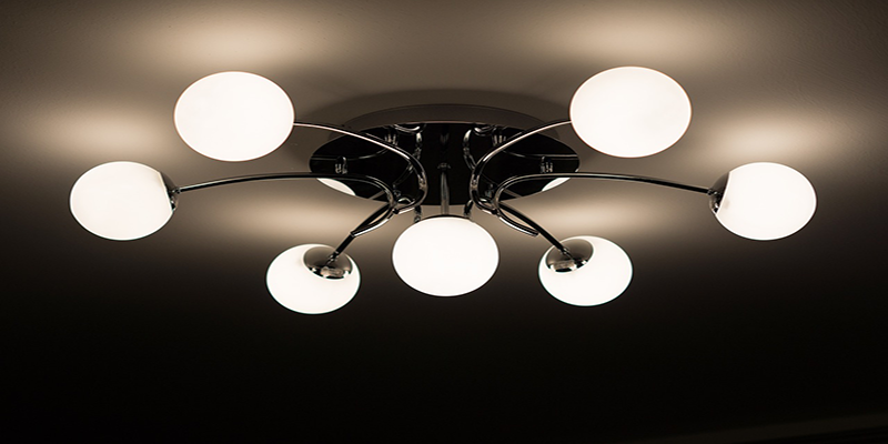 Modern ceiling light fixture with multiple glowing bulbs