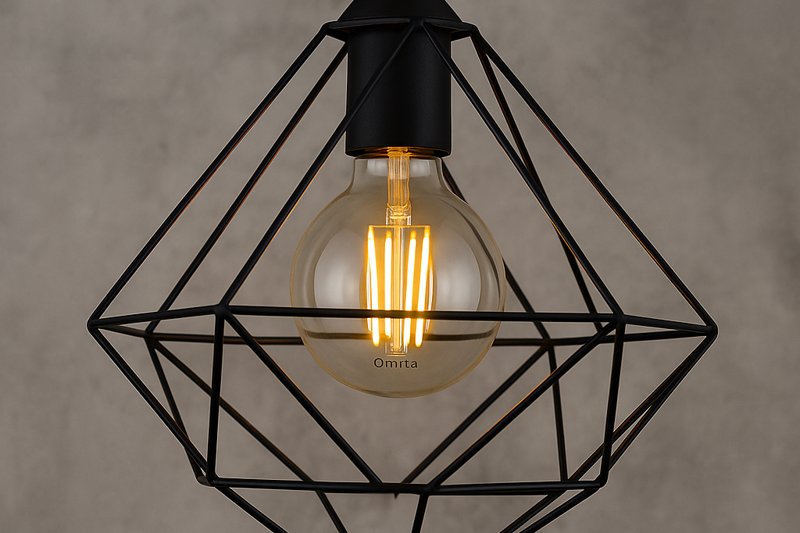 Geometric wire cage pendant light in diamond or cube shape featuring a clear Omita G95 LED Edison bulb glowing warmly inside