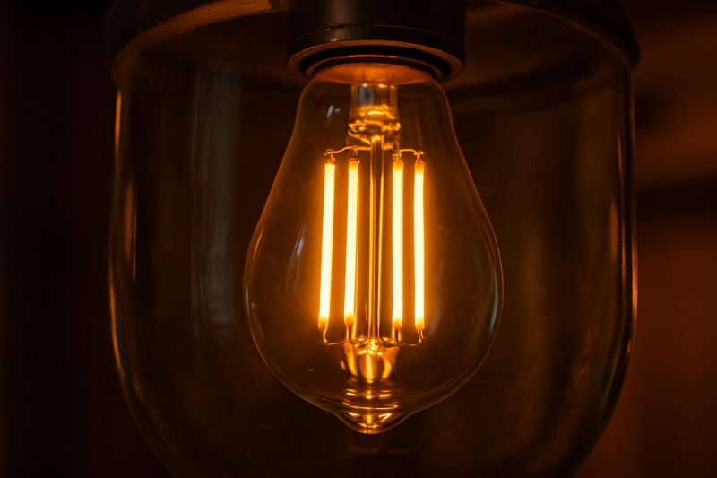 LED filament bulb glowing in clear glass