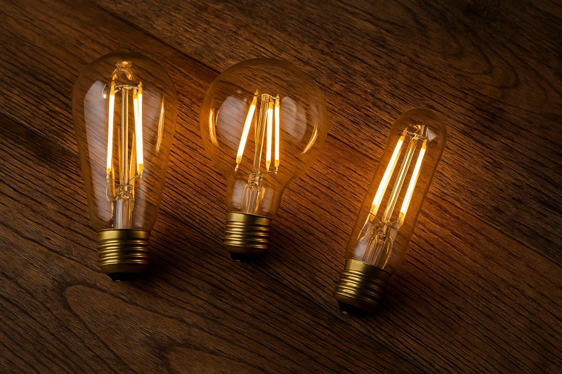 ST64, G95, and T45 bulbs side-by-side on wood